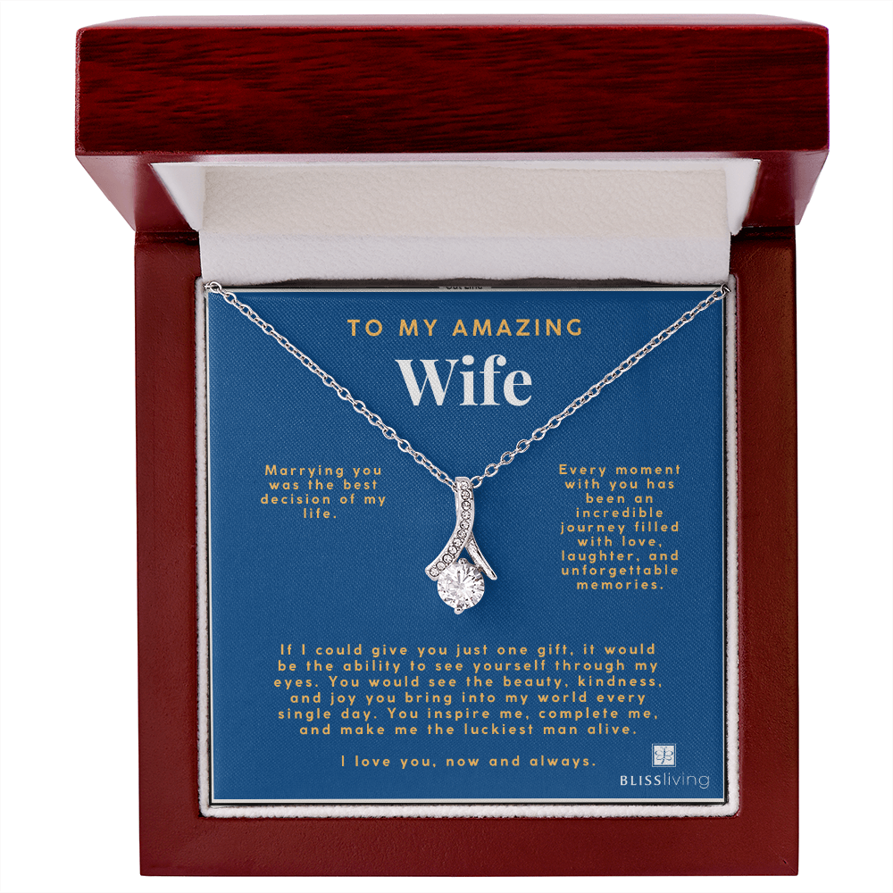 Image shows a pendant necklace for My Amazing Wife with a heartfelt message on a blue background on BlissLiving.com.