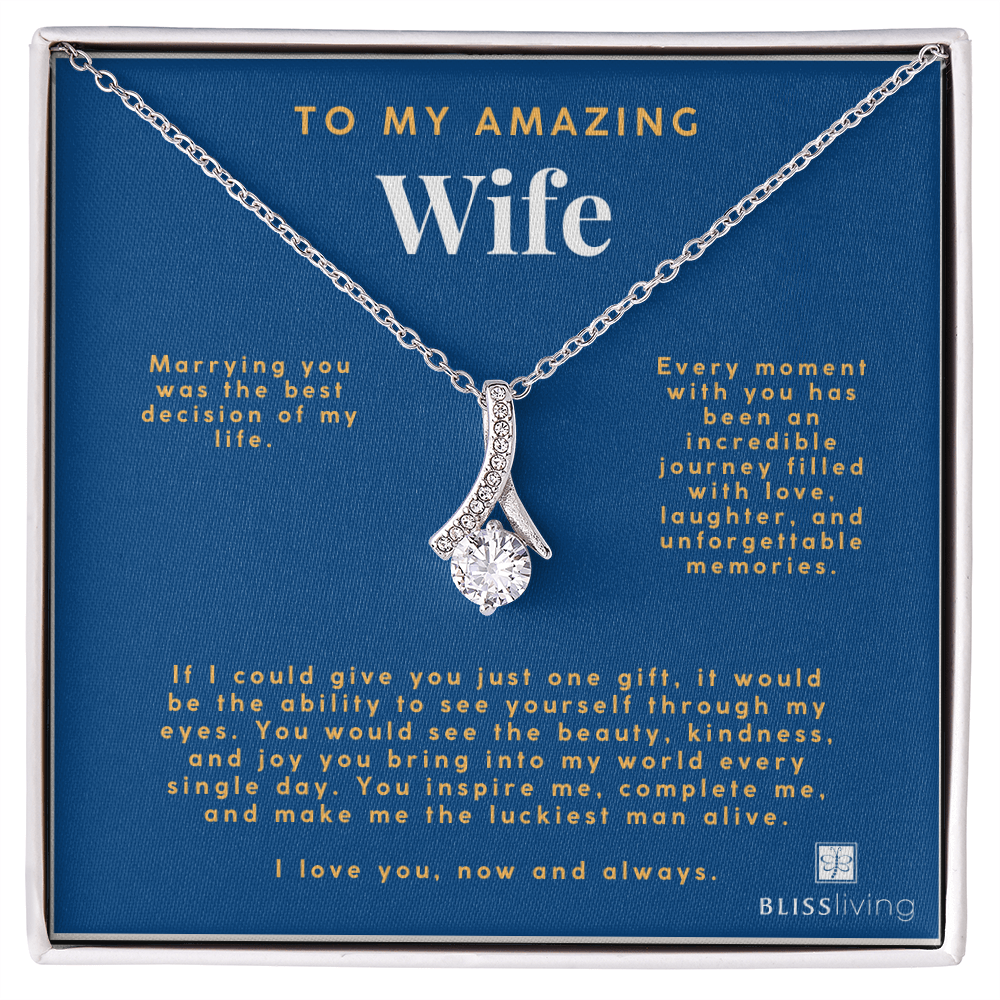 Image shows a pendant necklace for My Amazing Wife with a heartfelt message on a blue background on BlissLiving.com.