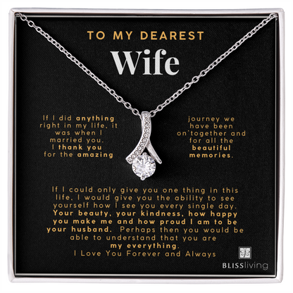 Image shows a pendant necklace for My Dearest Wife with a heartfelt message on a black background on BlissLiving.com.